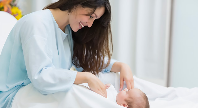 A new mother holding her newborn baby