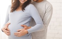 A man hugging his pregnant wife